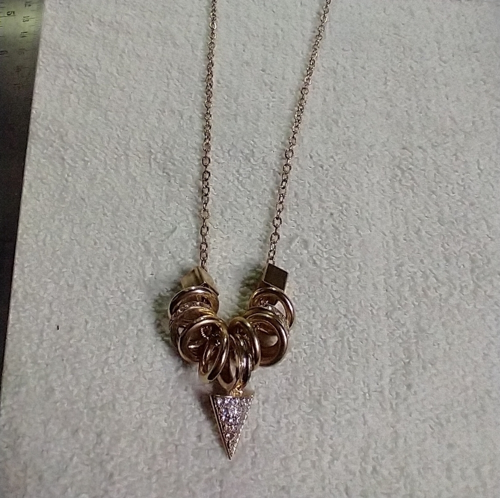 Long goldtone crystal arrowhead statement runway necklace